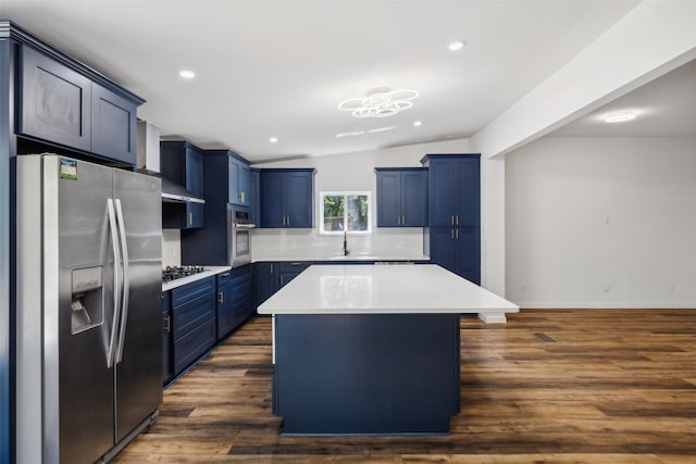 kitchen featuring appliances with stainless steel finishes, lofted ceiling, dark wood-type flooring, and a kitchen island