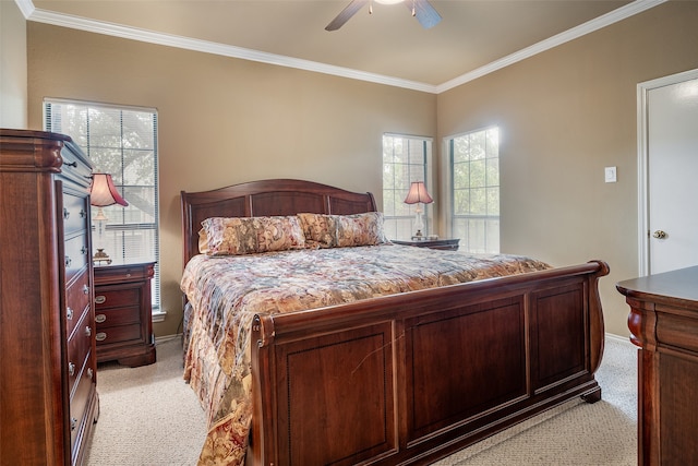 carpeted bedroom featuring ceiling fan, ornamental molding, and multiple windows