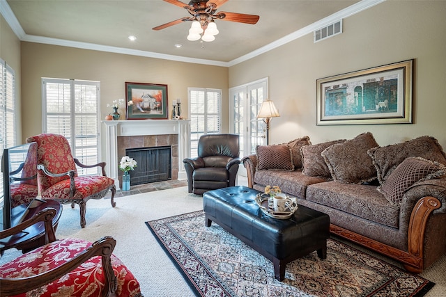 living room featuring light colored carpet, ornamental molding, and a fireplace