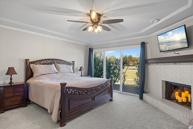 bedroom featuring ceiling fan, light carpet, a fireplace, and access to exterior