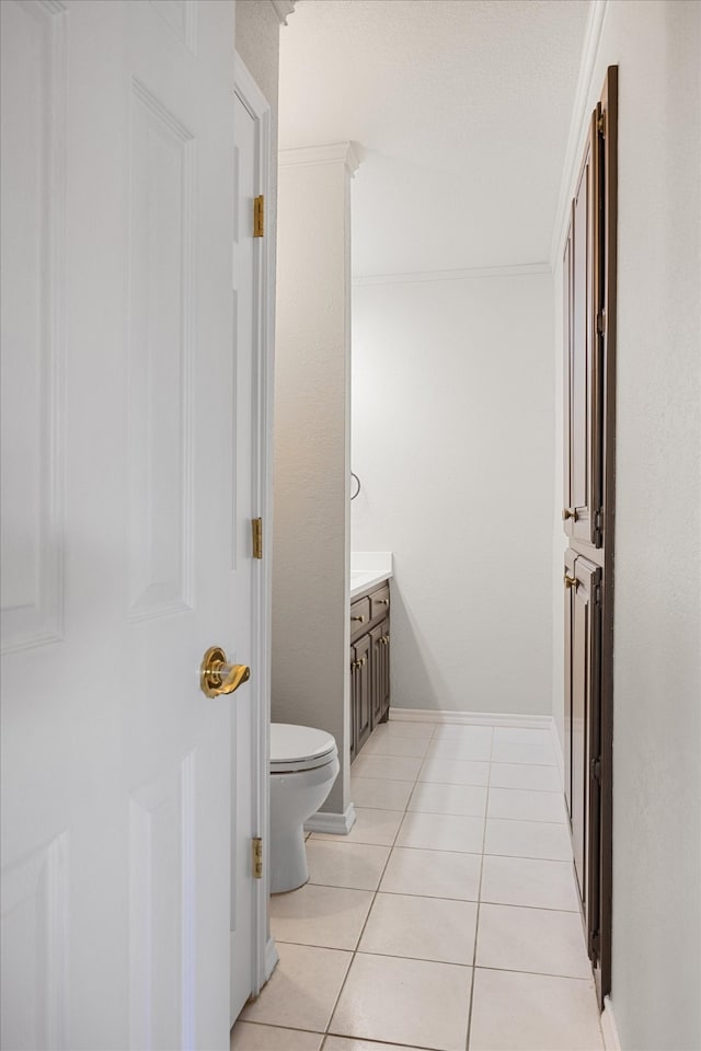 bathroom featuring vanity, toilet, and tile patterned flooring