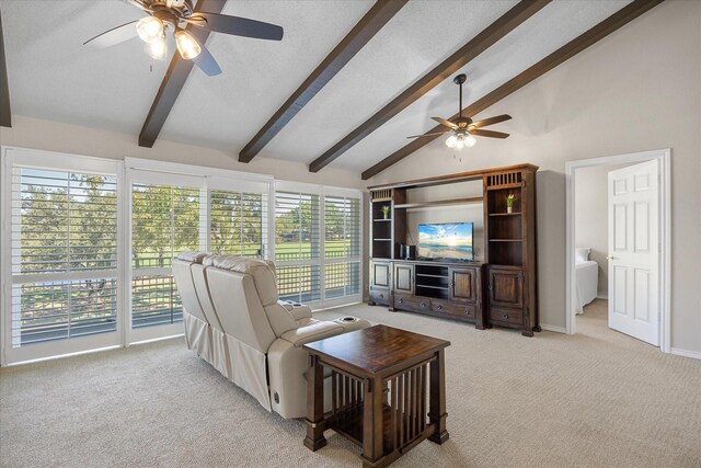 carpeted living room featuring vaulted ceiling with beams and ceiling fan