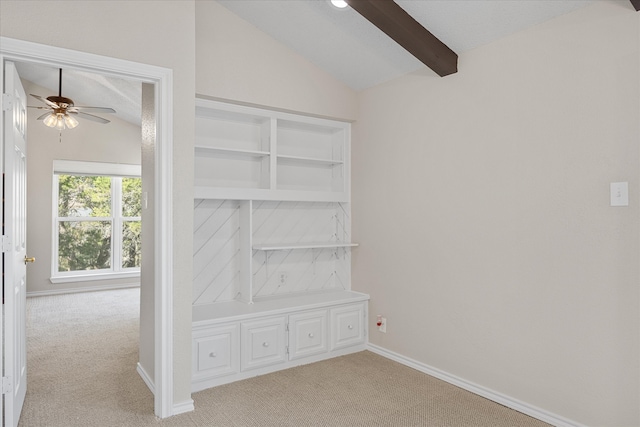 interior space featuring lofted ceiling with beams, light colored carpet, and ceiling fan