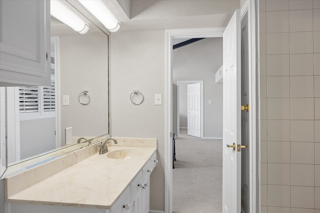 bathroom with vanity and a textured ceiling