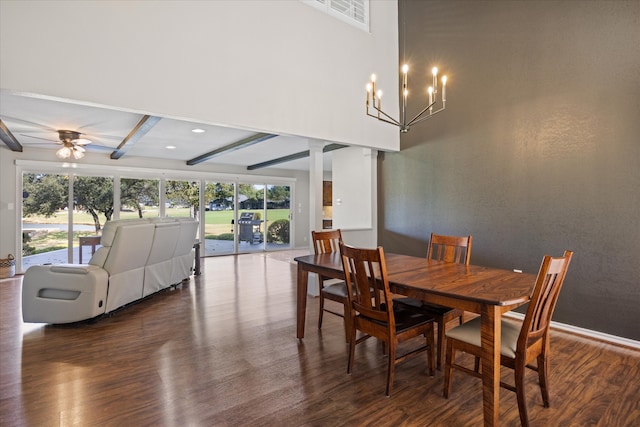 dining space with ceiling fan with notable chandelier, beam ceiling, and dark hardwood / wood-style floors