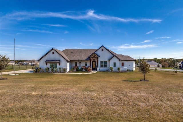 modern farmhouse style home with a front yard