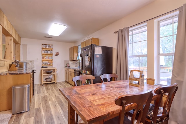 dining room featuring light hardwood / wood-style flooring