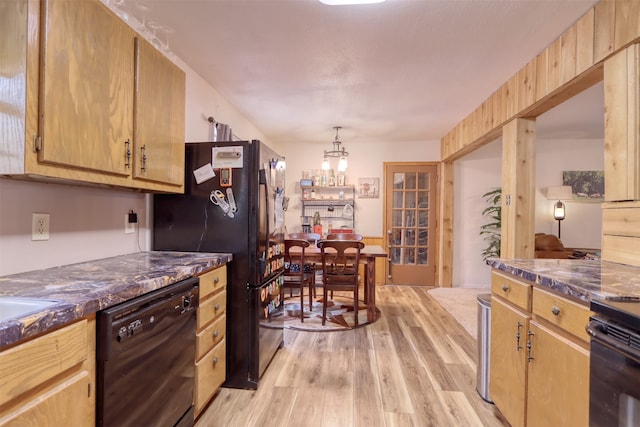 kitchen featuring light brown cabinets, black appliances, light wood-type flooring, and pendant lighting