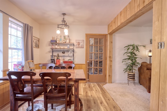 dining area featuring a chandelier and light hardwood / wood-style floors