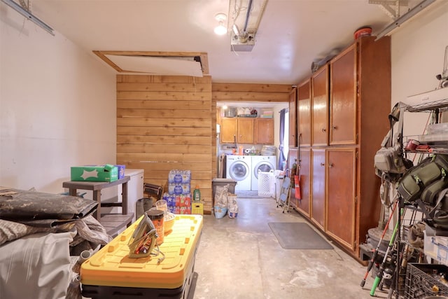 6495 Waterworks Rd, Midlothian, TX 76065 - washroom with washing machine and clothes dryer, a garage, and wooden walls