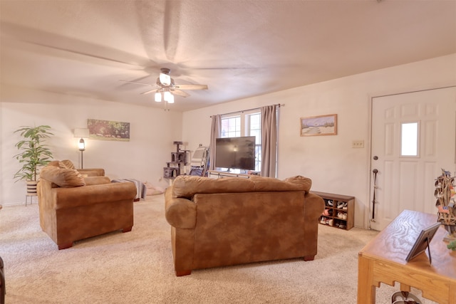 carpeted living room featuring ceiling fan