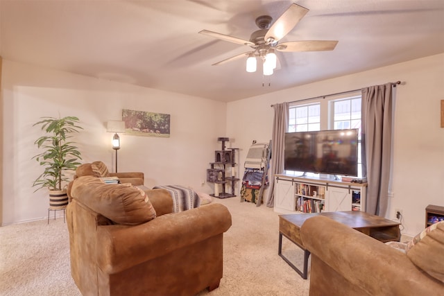 carpeted living room featuring ceiling fan