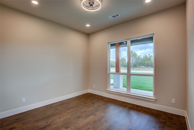 empty room with dark wood-type flooring