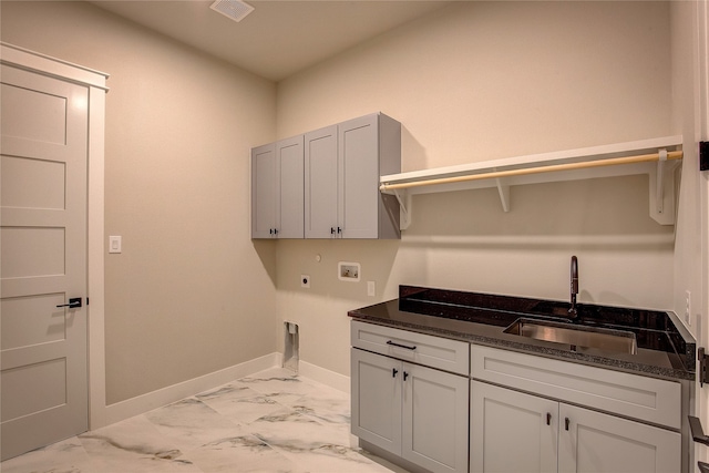 laundry room featuring cabinets, sink, washer hookup, and electric dryer hookup