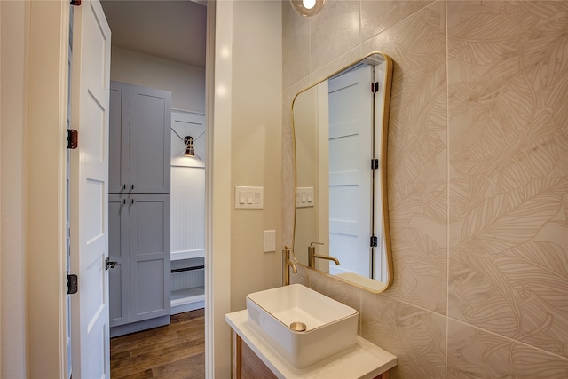 bathroom with vanity and hardwood / wood-style flooring