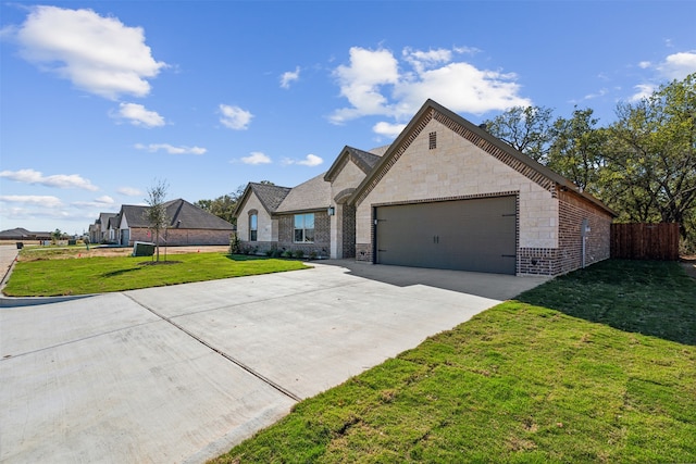 view of front of house featuring a garage and a front yard