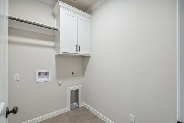 clothes washing area with cabinets, washer hookup, electric dryer hookup, hookup for a gas dryer, and crown molding