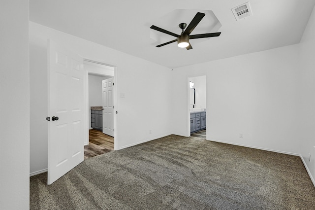 carpeted empty room featuring ceiling fan