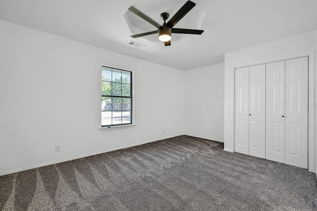 608 N Ave, Whitesboro, TX 76273 - unfurnished bedroom featuring dark carpet, a closet, a ceiling fan, and baseboards