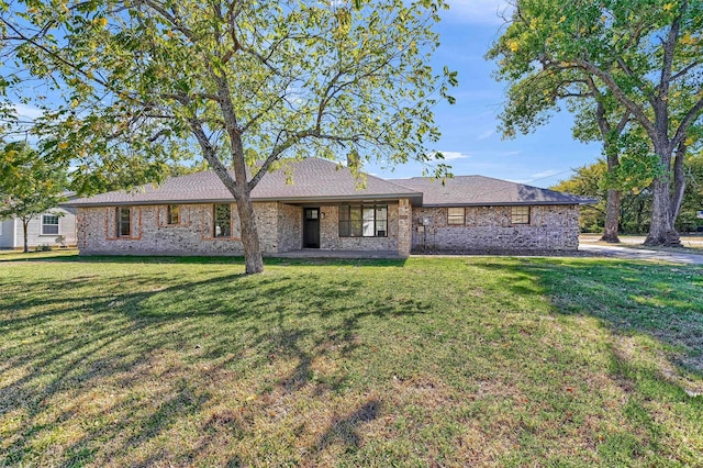 rear view of property with a lawn