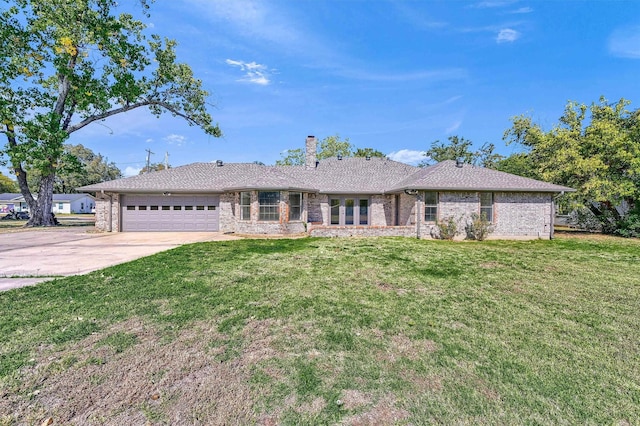 608 N Ave, Whitesboro, TX 76273 - ranch-style house with a chimney, an attached garage, driveway, brick siding, and a front yard