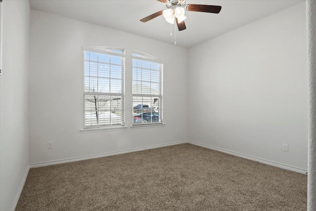 empty room featuring carpet and ceiling fan