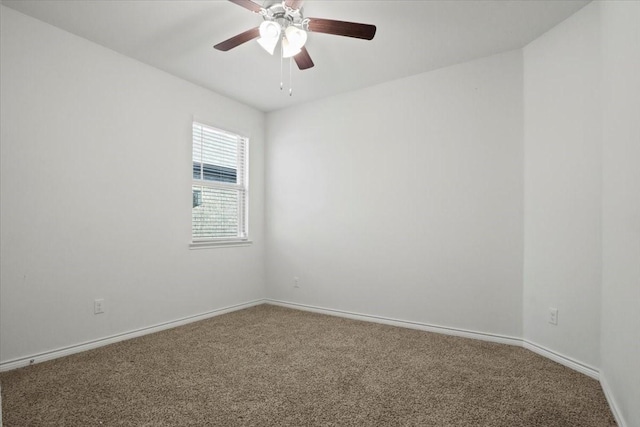 spare room with ceiling fan and carpet flooring