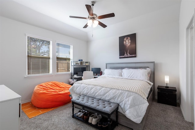 bedroom featuring vaulted ceiling, carpet flooring, and ceiling fan