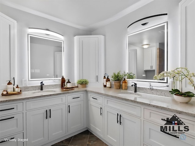 bathroom with tile patterned floors and vanity