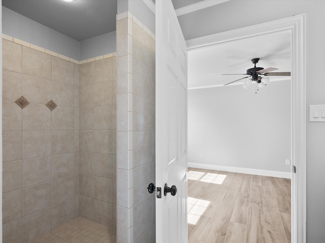 bathroom with hardwood / wood-style flooring and ceiling fan