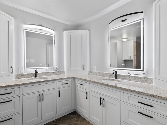 bathroom featuring ornamental molding, vanity, and tile patterned floors