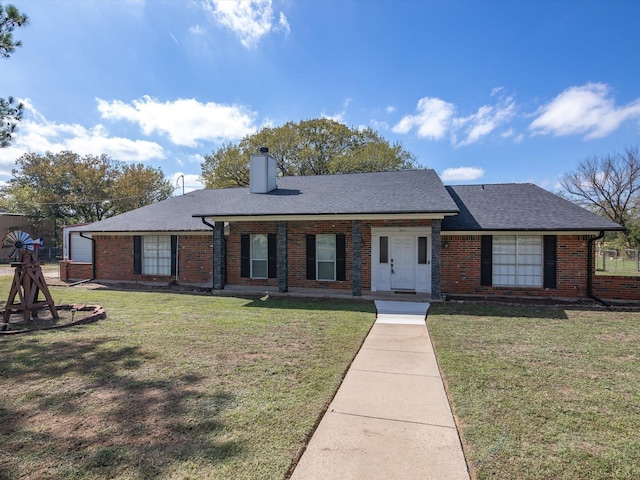 single story home with a garage and a front lawn