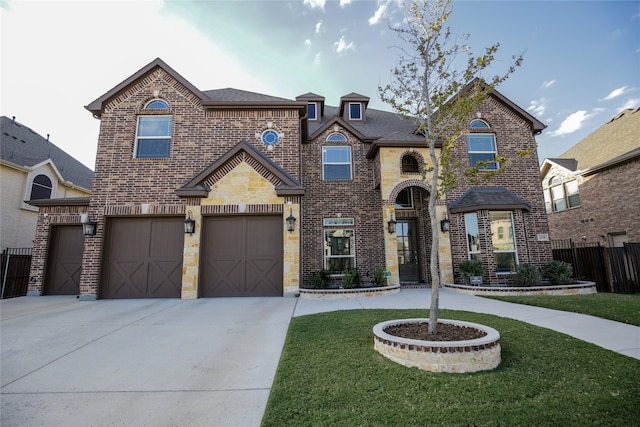 view of front facade with a front lawn and a garage