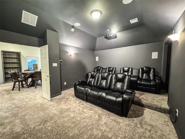 home theater featuring carpet flooring and lofted ceiling