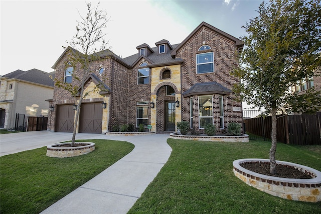 view of front facade with a front yard and a garage