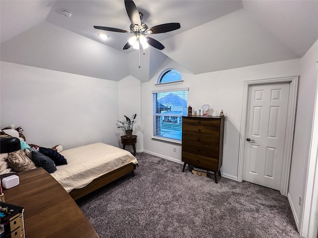 bedroom featuring vaulted ceiling, dark carpet, and ceiling fan