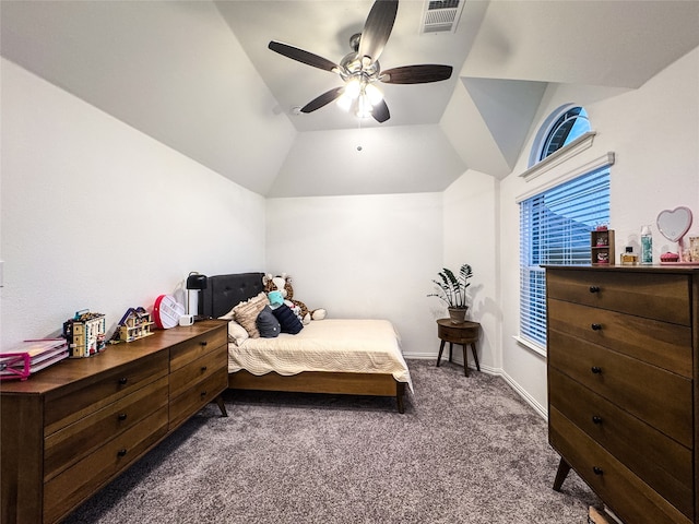 bedroom featuring ceiling fan, vaulted ceiling, and dark carpet