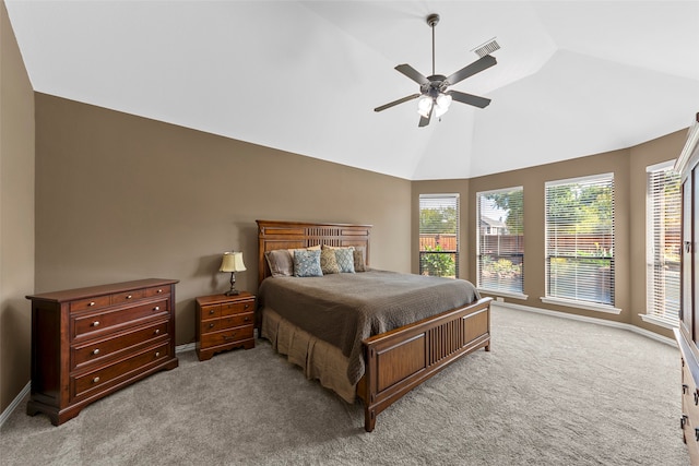 living room with ceiling fan, a stone fireplace, and high vaulted ceiling