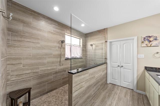 carpeted bedroom with ceiling fan and lofted ceiling