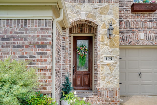 doorway to property featuring a garage