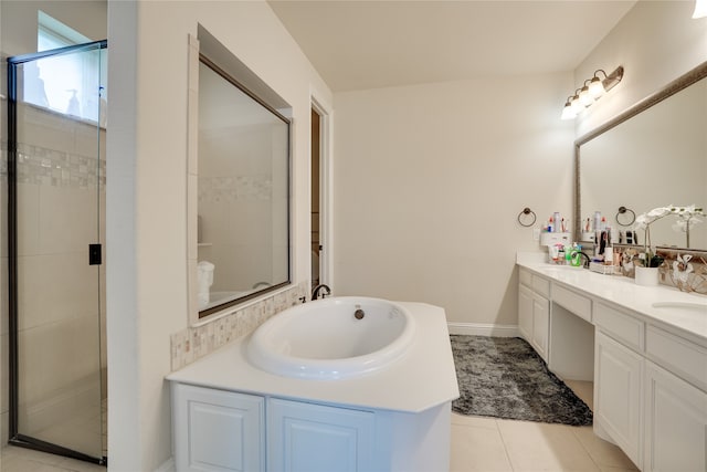 bathroom with vanity, an enclosed shower, and tile patterned floors