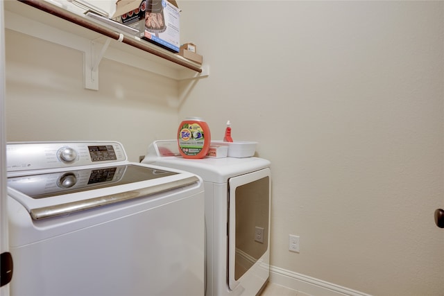 laundry room featuring washing machine and dryer