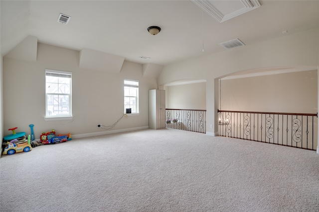 interior space with carpet floors and vaulted ceiling