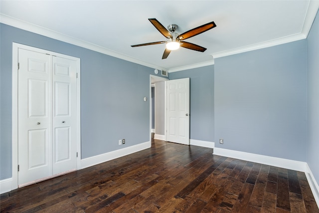 unfurnished bedroom with a closet, ceiling fan, crown molding, and dark hardwood / wood-style floors