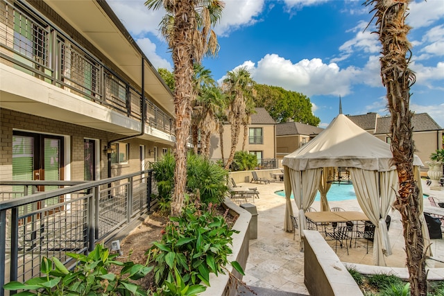 view of patio with a community pool