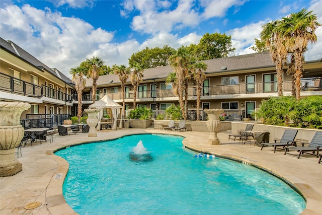 view of swimming pool featuring a gazebo and a patio area