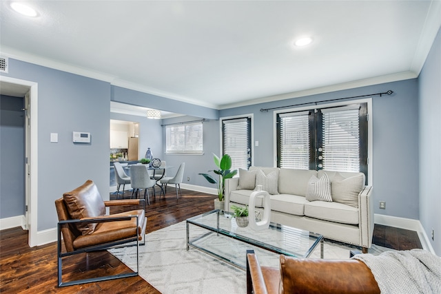 living room with hardwood / wood-style floors and ornamental molding