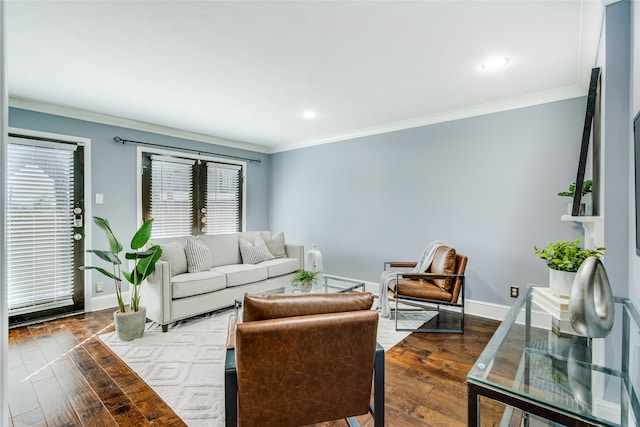 living room with hardwood / wood-style floors and ornamental molding