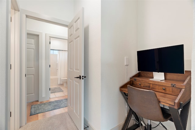 office area with light wood-style floors