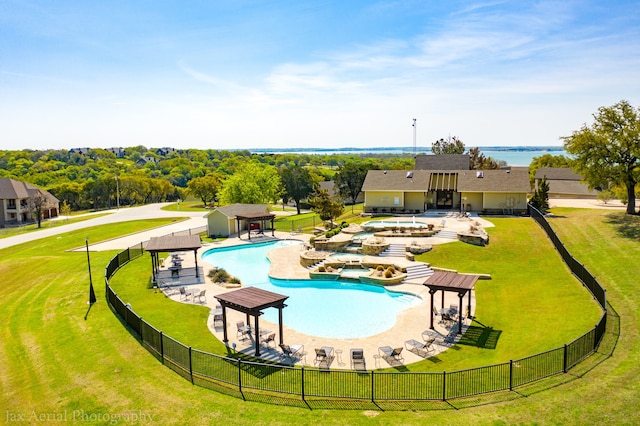 view of swimming pool featuring a patio and a lawn